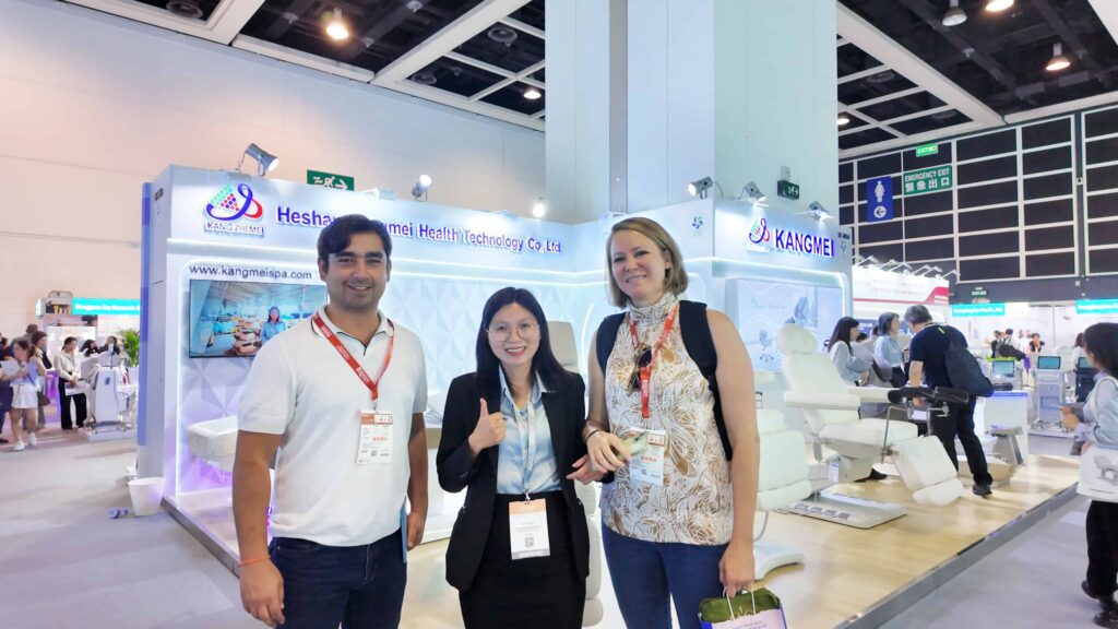 Visitors experiencing Kangmei spa equipment at Cosmoprof Asia 2025